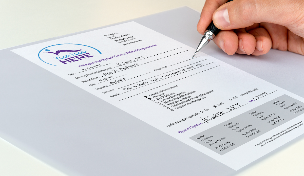image of a physician referral pad being filled out