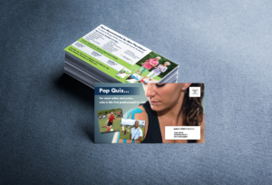 Jumbo-Postcard-Feature-FRONT Picture of Jumbo postcard with female athlete looking at her kiniseotaped right shoulder.