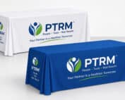 Custom health fair table covers shown here with sample branding for physical therapy marketing events and community outreach displays.